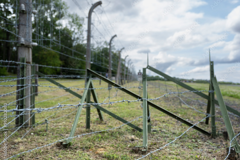 Concentration camp Buchenwald memorial site. Focus on the barbed wire