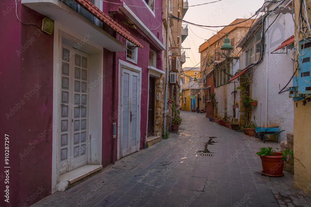 Obraz premium The narrow street in Sour (Sur), Lebanon, with designed colorful walls. 