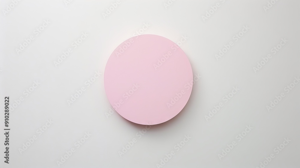 Pink circle on white background. A single pink circle sits in the center of a white background. The circle is a simple, minimal shape with a smooth, flat surface.