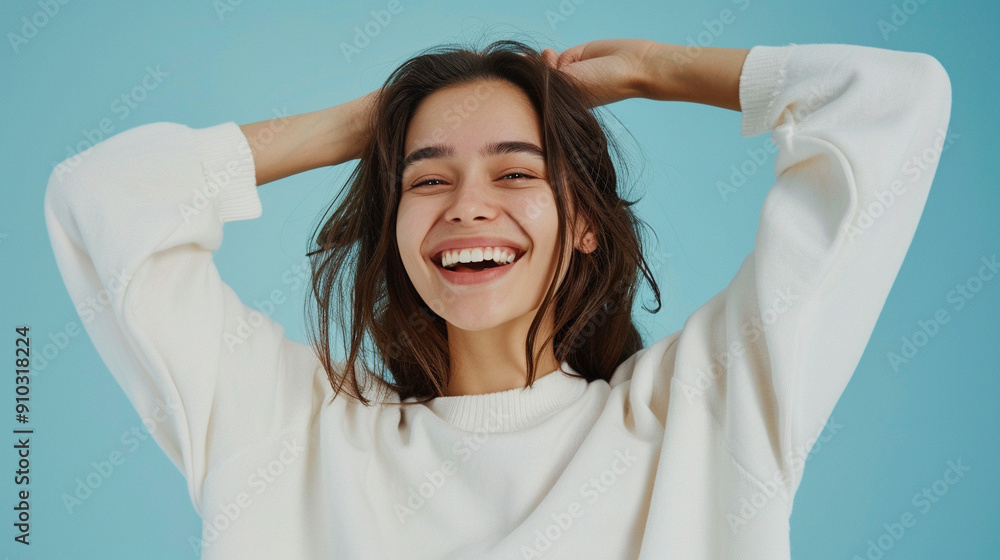 Happy woman isolated on pastel blue background Happy woman isolated on pastel blue background