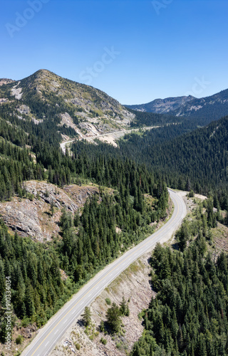 Scenic Highway in the valley going over the Mountain Pass. Sunny Summer Day.