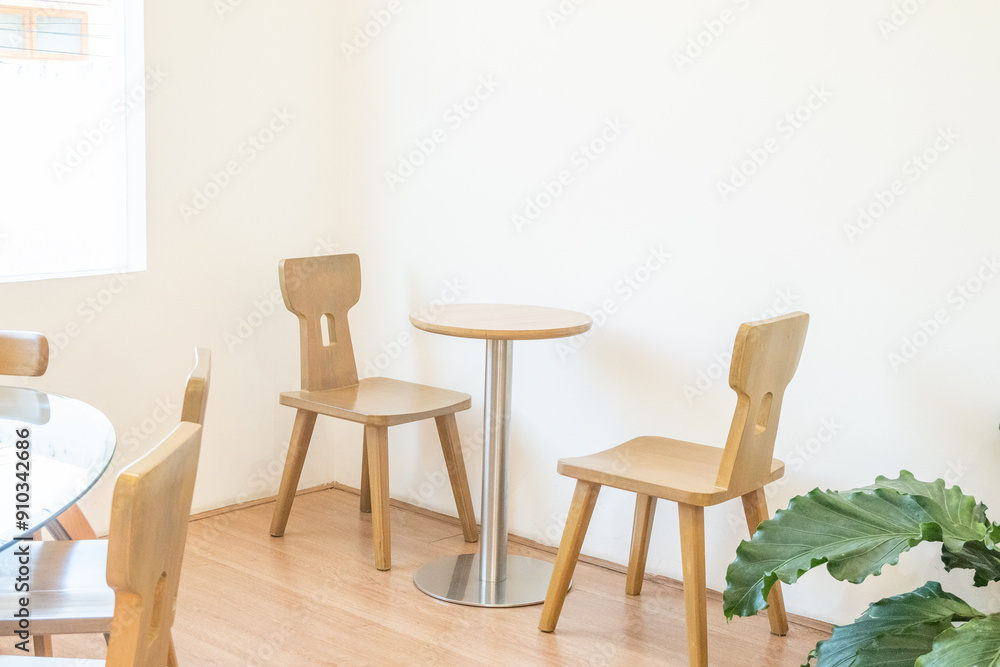 Empty wooden chairs and table in dining room,tropical plants and elegant personal accessories in stylish home decor,Template.. Empty wooden chairs and table in dining room,tropical plants and elegant personal accessories in stylish home decor,Template..