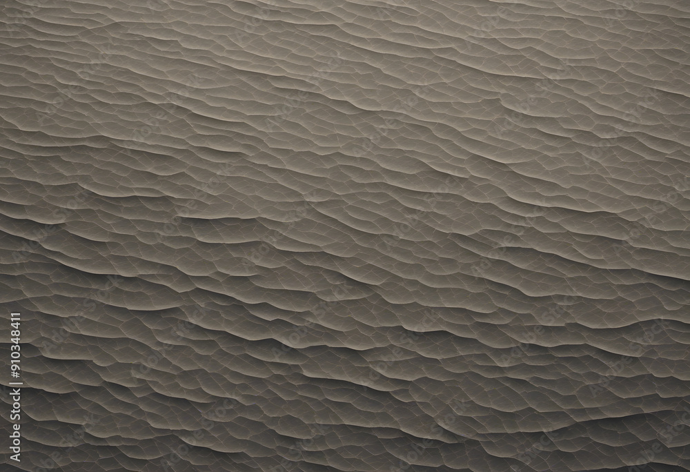 Obraz premium Aerial view of textured sand dunes, showcasing intricate patterns and waves in the sand. The color palette is muted, with shades of brown and beige, creating a serene and natural landscape.