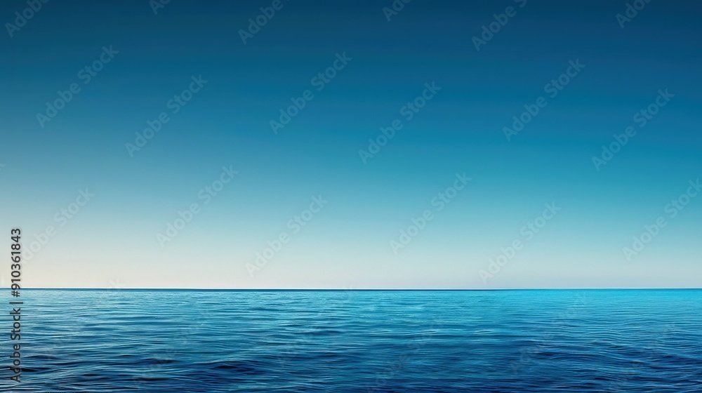 Obraz premium A smooth gradient abstract wallpaper transitioning from deep ocean blue at the bottom to a light sky blue at the top, simulating a serene horizon.