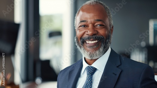 Smiling portrait of a senior African American businessman in office