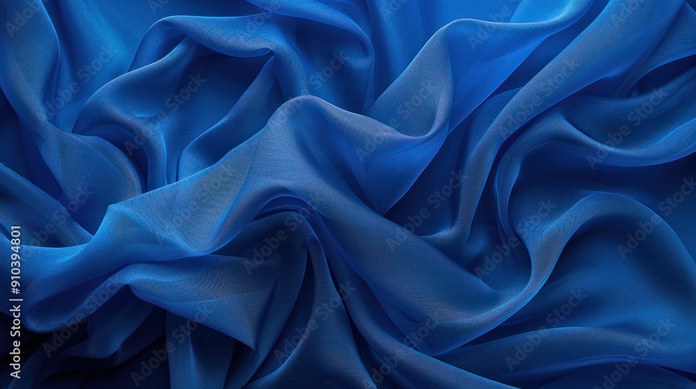 Fototapeta premium Canvas or muslin fabric cloth backdrop suitable for portraits products or concepts, with dramatic blue modulations.