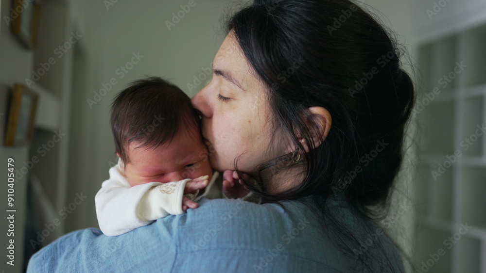 Mother Embracing Newborn, Maternal Love in First Days of Life, Mom Kissing Baby on Cheek Mother Embracing Newborn, Maternal Love in First Days of Life, Mom Kissing Baby on Cheek
