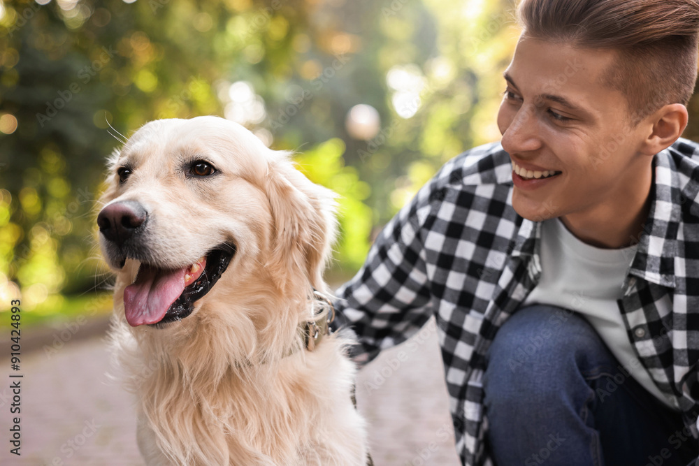 Portrait of happy owner with cute Golden Retriever dog outdoors Portrait of happy owner with cute Golden Retriever dog outdoors