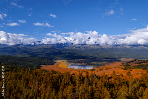 Autumn landscape Altai yellow forest crystal clear lake Dzhangyskol and snowy mountain peaks, aerial view photo