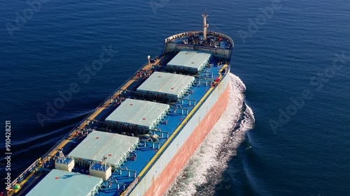 Bulk cargo carrier ship underway in sea. Dry cargo vessel merchant ship to transport bulk cargo such as grains ore coal
