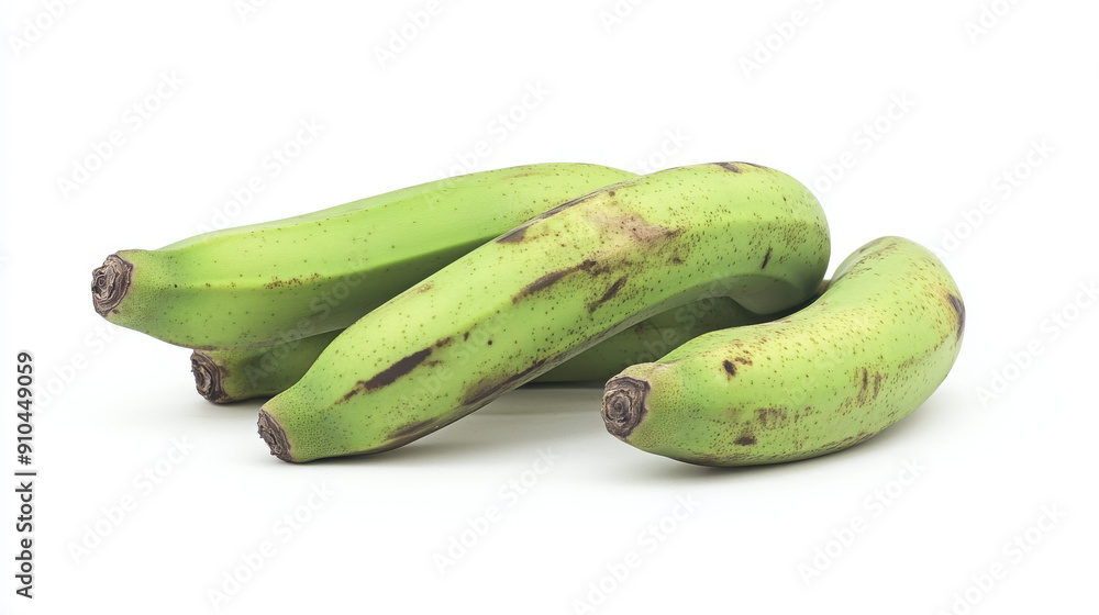 Green bananas stand alone on a white background. Green bananas stand alone on a white background.