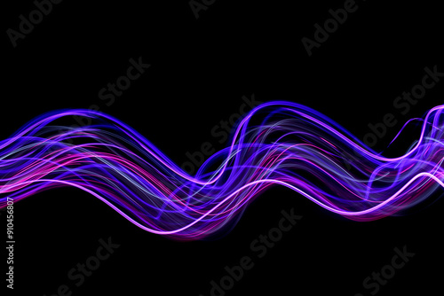 Light Painting Photography - swirly waves of neon purple light against a black background. Long exposure photograph. 