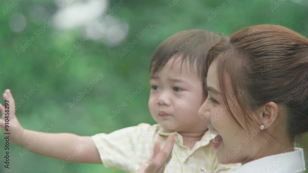 Mother and son walking in the park Mother and son walking in the park