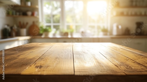 A plain, bare wooden table sits in a well-lit kitchen. The background is a blur of bright white and warm golden sunlight.