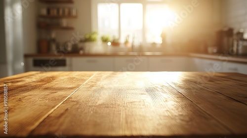 A plain, bare wooden table sits in a well-lit kitchen. The background is a blur of bright white and warm golden sunlight.