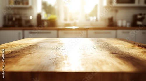 A plain, bare wooden table sits in a well-lit kitchen. The background is a blur of bright white and warm golden sunlight.