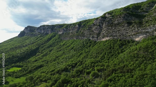 Panoramic mountain view near the village of Saou in the Drome department in France of the Vercors hills, the marly hills and the Val de Drome valley. The Saou forest and the 3 peaks - Drome Valley photo