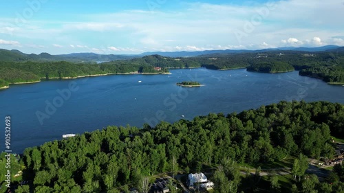 Floating sailboats and passenger ship carrying people on Solina lake in Polish Bieszczady Mountains, Poland. Subcarpathian mountains. photo