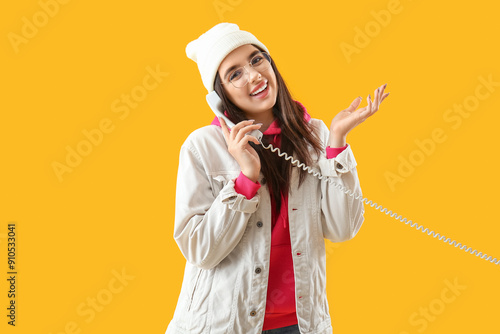 Pretty young woman talking ...