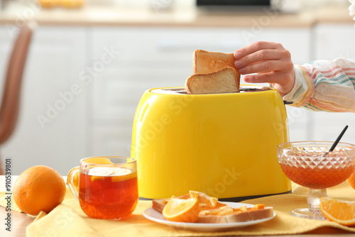 Woman taking crispy bread s...