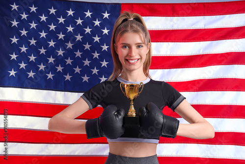 Female boxer with gold cup ...