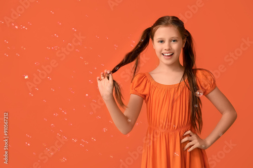 Happy girl with soap bubble...