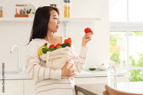 Young Asian woman holding t...