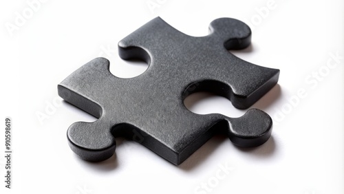 Isolated black puzzle piece on a white background, showcasing intricate details and texture, symbolizing problem solving, strategy, and critical thinking in a minimalist composition.