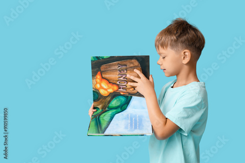 Cute little boy turning pag...
