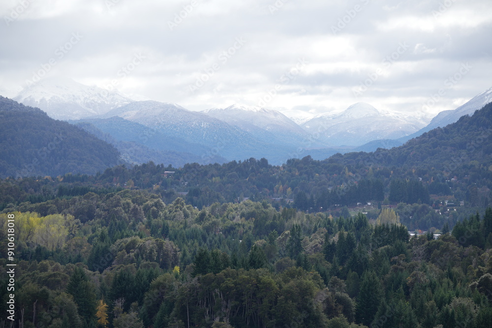 Valley with Snow-Covered Mountains and Forest Valley with Snow-Covered Mountains and Forest