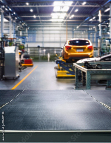 A metal blank tabletop with blurred automotive tools and parts in the background suitable for promoting automotive products photo