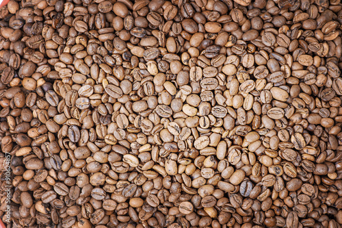 Фотография Roasted coffee beans as a background. Coffee, cheerfulness