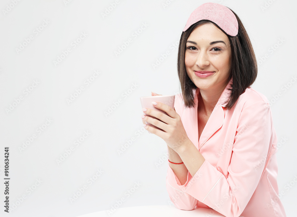 lifestyle and people concept: beautiful asian girl dressed in pajamas drinking milk lifestyle and people concept: beautiful asian girl dressed in pajamas drinking milk