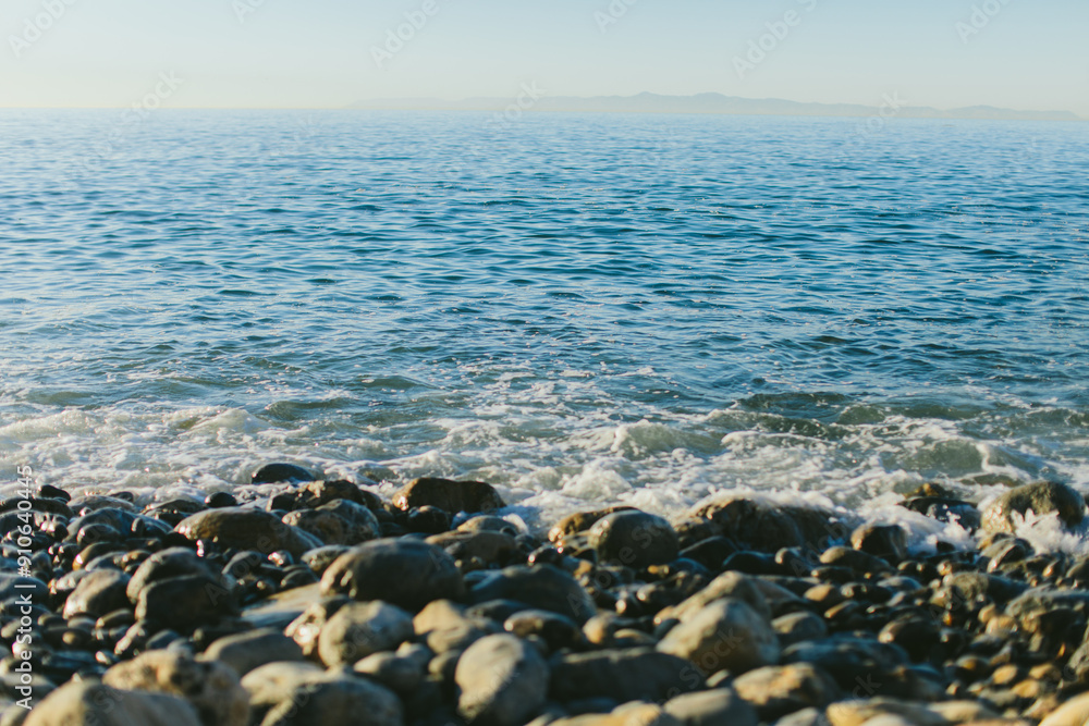 Serenity by the Sea: Rocks, Ocean, and Blue Sky Serenity by the Sea: Rocks, Ocean, and Blue Sky