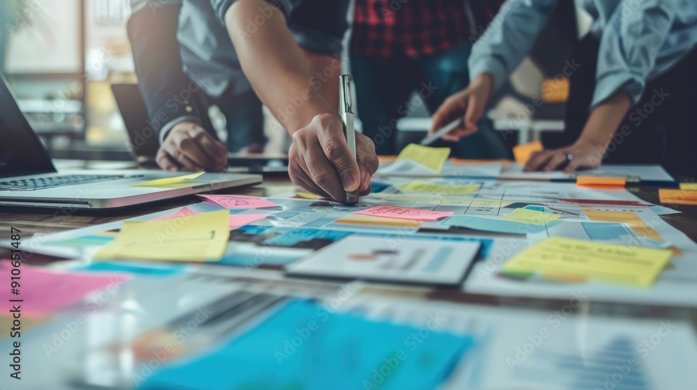 Businesspeople Collaborating on a Project Using Sticky Notes Businesspeople Collaborating on a Project Using Sticky Notes