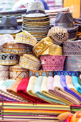 Traditional hats and textiles in the old souk of Mutrah, Muscat, Oman