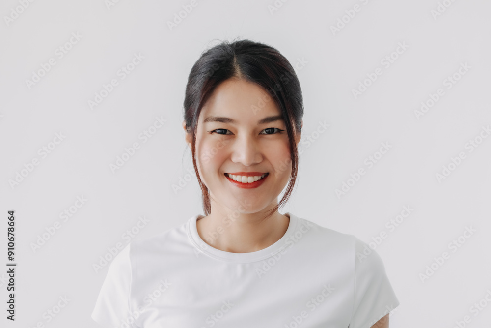Beautiful asian Thai woman wear white, smiling and looking at camera, standing isolated over white background wall. Beautiful asian Thai woman wear white, smiling and looking at camera, standing isolated over white background wall.