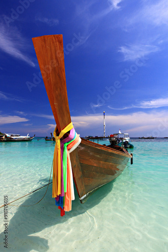 Scenic view white sand beach and crystal Andaman Sea against blue sky at Koh Lipe in Satun Province, Thailand  photo