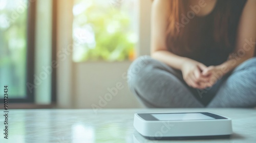 Tablet on a Table with a Woman in the Background