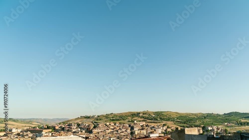 Pietraperzia, Sicily, Italy. Smooth transition from day to night. Panorama of the city with roofs, TimeLapse photo