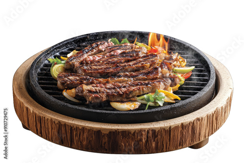 Juicy grilled meat sizzling on a hot plate, garnished with vibrant vegetables and aromatic herbs, perfect for any food lover. photo