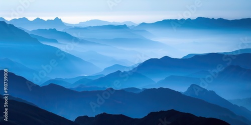 Silhouette of mountain ranges shrouded in morning mist