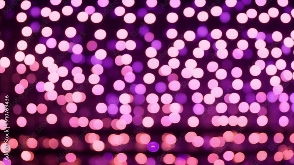 Purple and gold lights color fall on a dark black background in an abstract order, beautiful reflection of glare from the light, bokeh and out of focus glare. Slow motion, 4K. Purple and gold lights color fall on a dark black background in an abstract order, beautiful reflection of glare from the light, bokeh and out of focus glare. Slow motion, 4K.