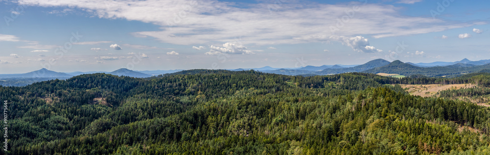 Obraz premium Panoramic shot of beautiful summer landscape full of forests and hills
