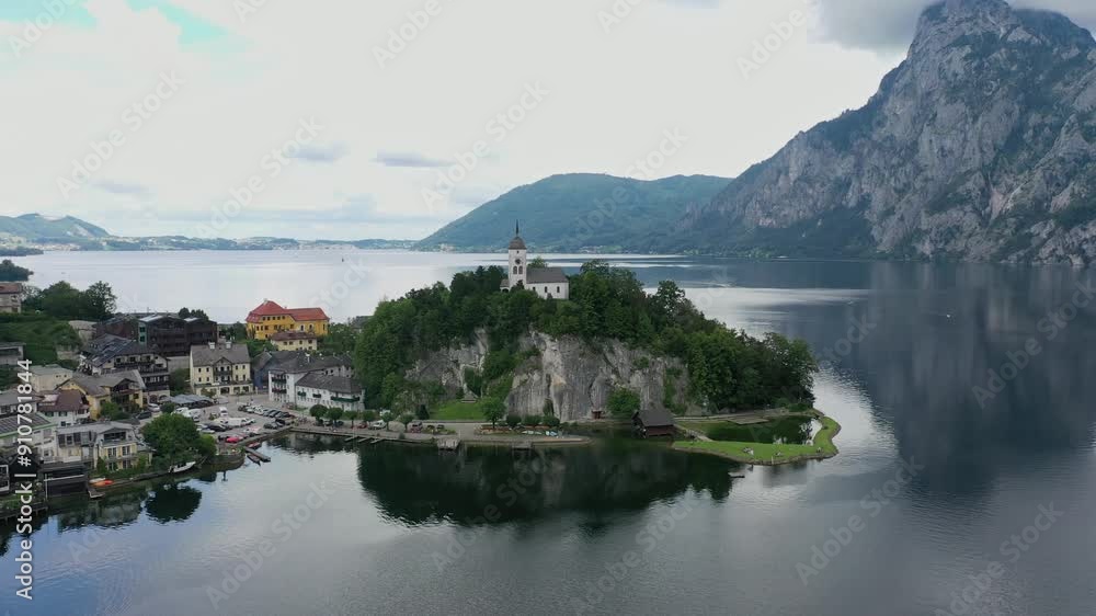 Aerial view of church and lake Traunsee in Traunkirchen village, Upper Austria, Alps on a cloudy summer day Aerial view of church and lake Traunsee in Traunkirchen village, Upper Austria, Alps on a cloudy summer day
