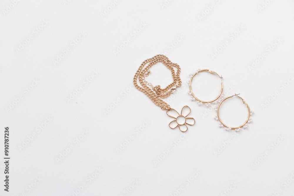 Gold and silver jewellery. Pastel Background Gold and silver jewellery. Pastel Background