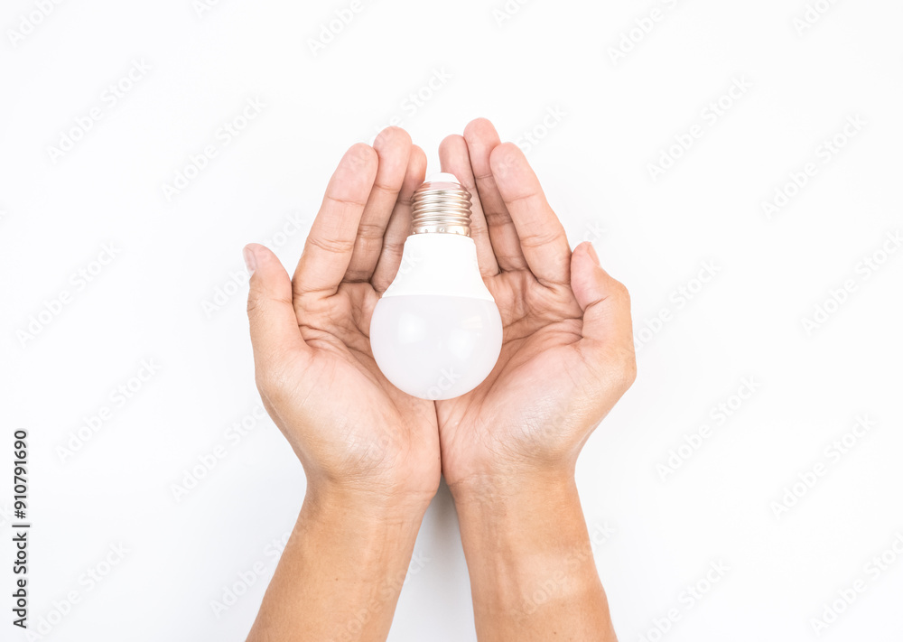 Close-up of hand holding light bulb. Isolated with white background. Close-up of hand holding light bulb. Isolated with white background.