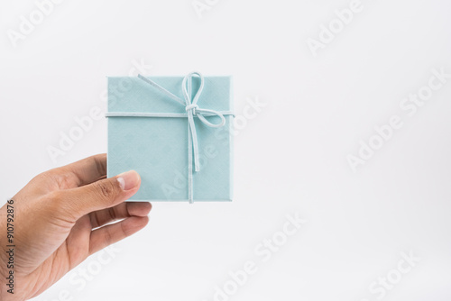 A man holding a gift box. Isolated with white background. photo