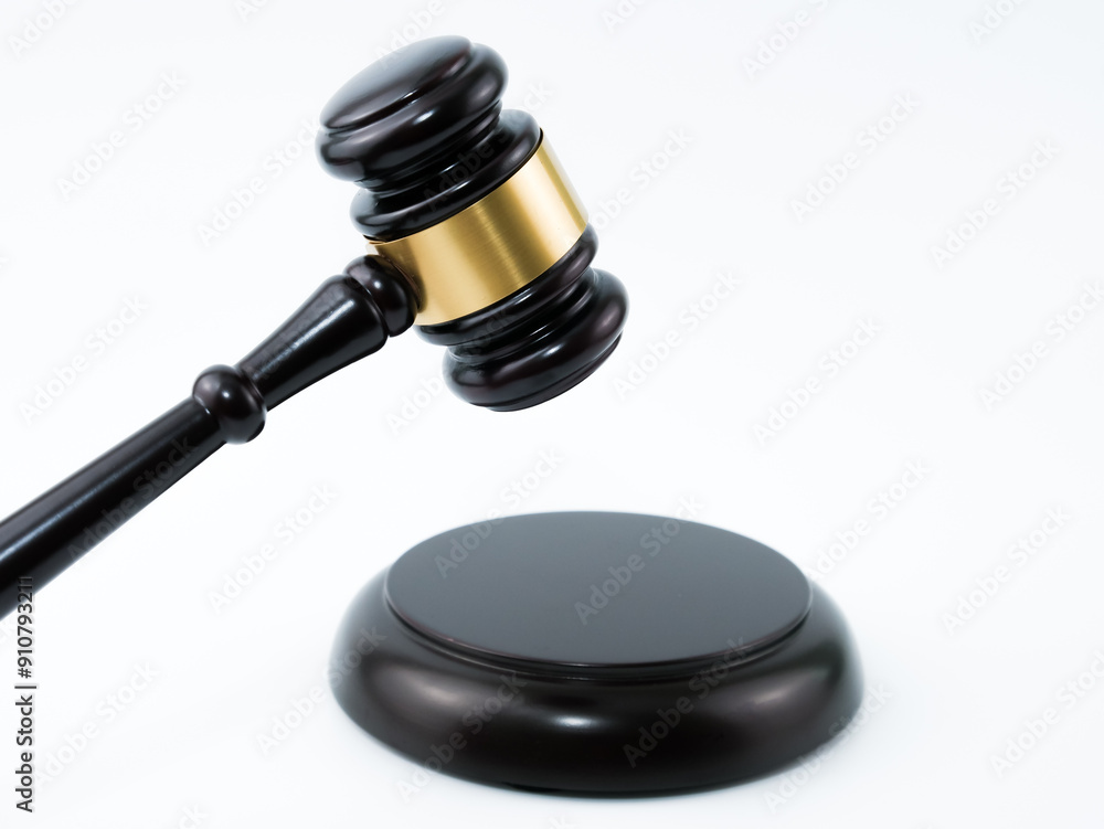 A wooden judge gavel and soundboard isolated with white background.