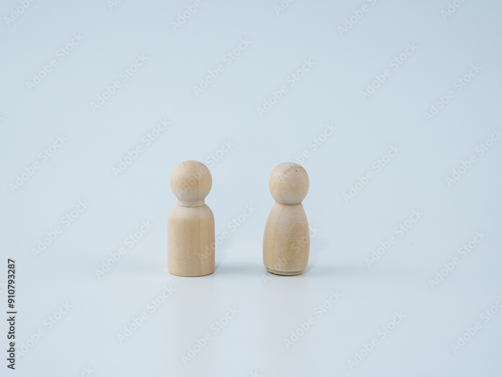 Wooden figures male and female isolated with white background. Wooden figures male and female isolated with white background.